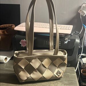 Maggie Bags recycled seatbelt purse in a tan or beige woven design